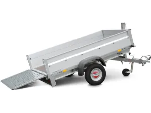 Tilt-bed trailer with ramp lowered, silver metal trailer on a single axle and hitch for towing, ready to load equipment.
