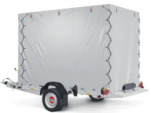 White enclosed cargo trailer on a small hitch-mounted trailer, visible rear ramp and wheel, ready for transport