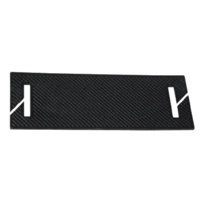 Black textured rectangular plate with diagonal pattern and white stylized end markers on both sides, showing cutouts.