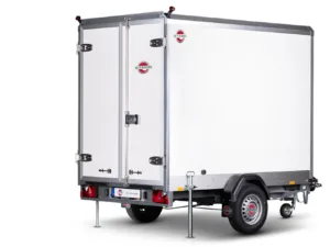 White enclosed cargo trailer with double rear doors, stabilizing legs down, and a single axle beneath a metal frame.