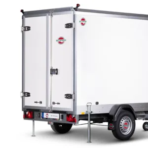 White enclosed cargo trailer with double rear doors, stabilizing legs down, and a single axle beneath a metal frame.