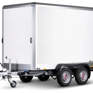 White enclosed cargo trailer with dual axles and a front hitch, STEMA logo visible on the side.